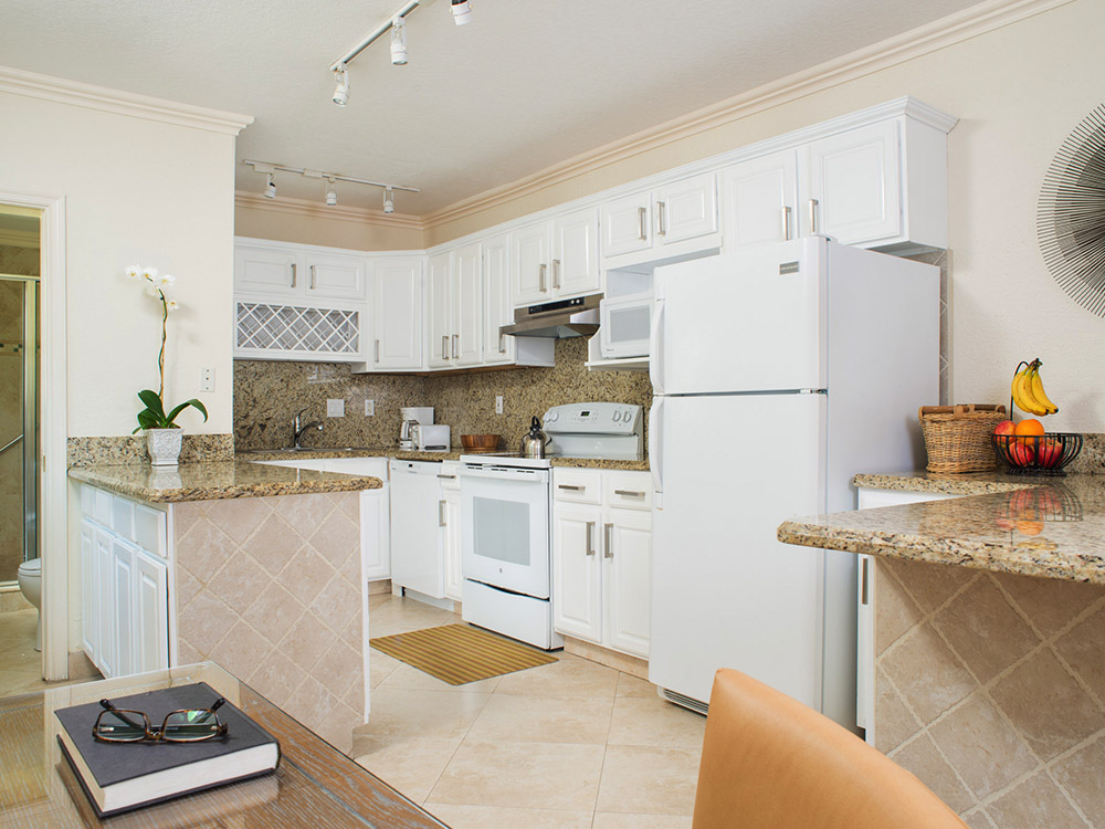 Photo of one of our rooms displaying a full kitchen.